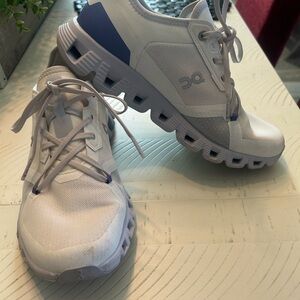 On Running White and Purple Athletic Shoes